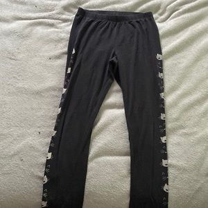 black leggings with cat print on the side